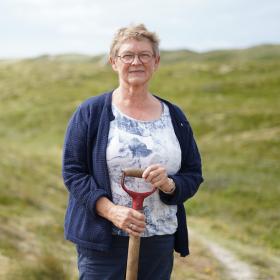 Woman standing by the sea